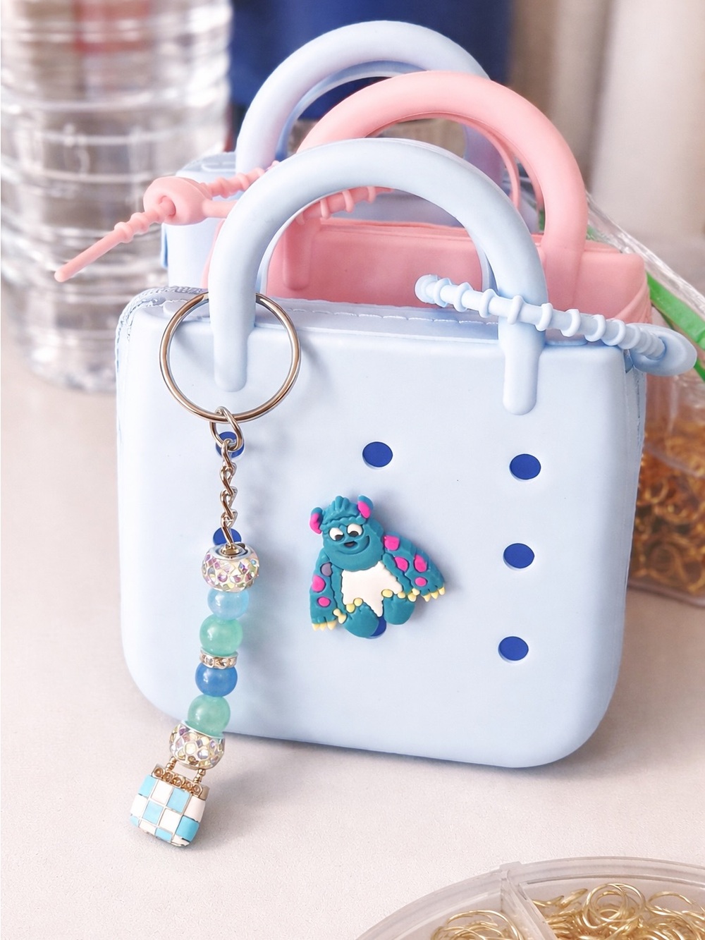 Blue Mini wallet tote with charm and sulley accent.